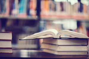 Book in library with open textbook,education learning concept